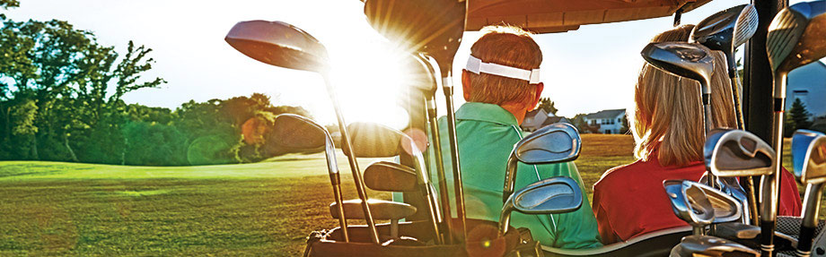 golf cart on a sunny lawn golf cart on a sunny lawn