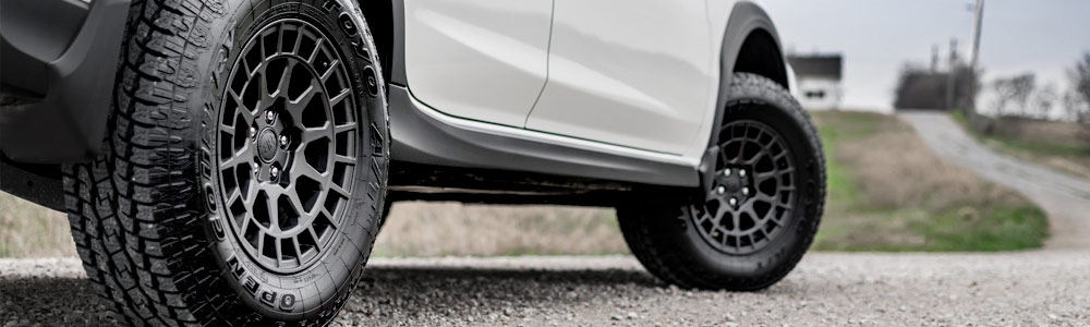 white soft-roading subaru with toyo tires